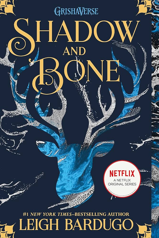 Shadow and Bone book cover. The image of an antlered deer in marbled blue coloring.