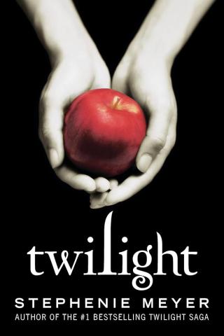 Twilight book cover featuring light colored hands cupped together holding a red apple in front of a black background